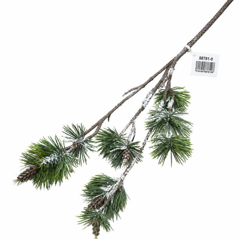Snowy artificial pine branch with pinecones