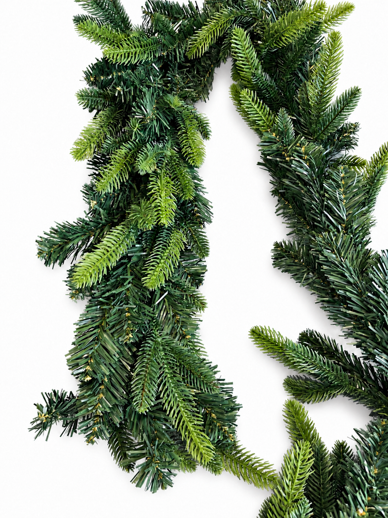 Close-up of mixed green needles on Christmas garland